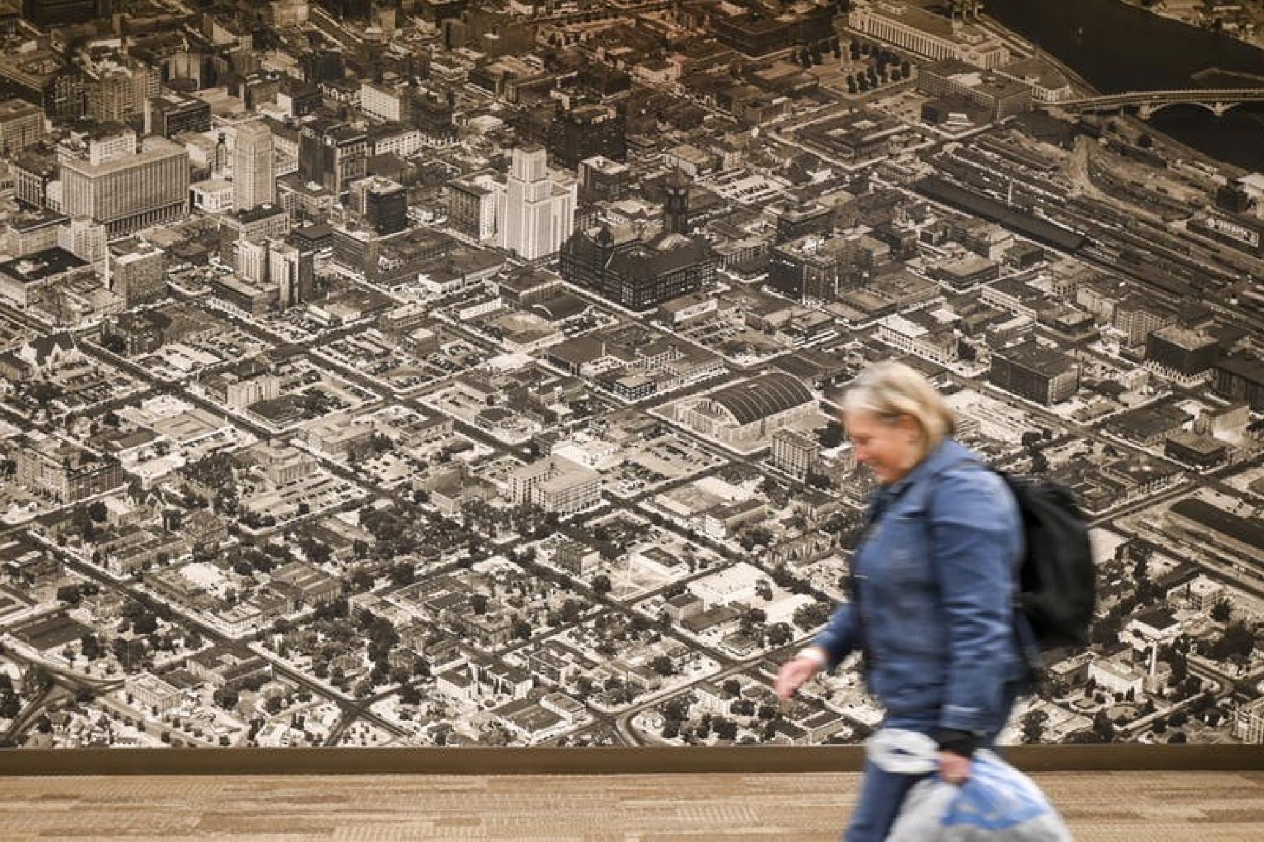 Large historical panoramas hang in the Wells Fargo Bank building's skyway in Downtown East