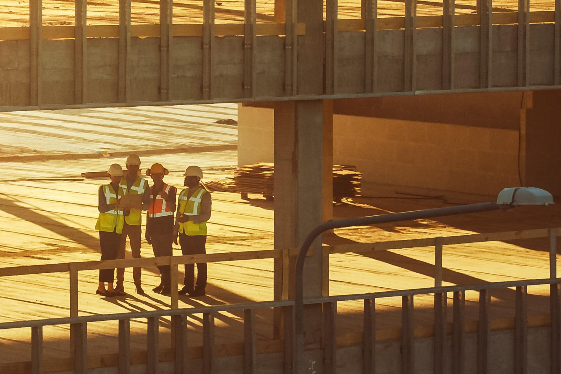 Team members collaborate at an active project site.