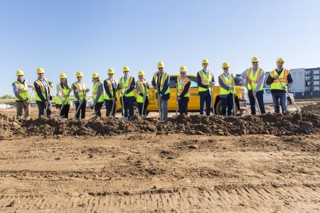 Several representatives from Ryan Companies, Great Lakes Management and other organizations pose for a groundbreaking photo. Talamore Senior Living Woodbury is a 200-unit senior living community that is expected to be completed in early 2023.