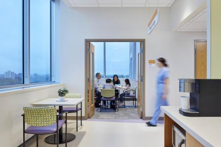 A family sits in the new family lounge area at the newly remodeled Children's Minnesota Pediatric Intensive Care Unit.